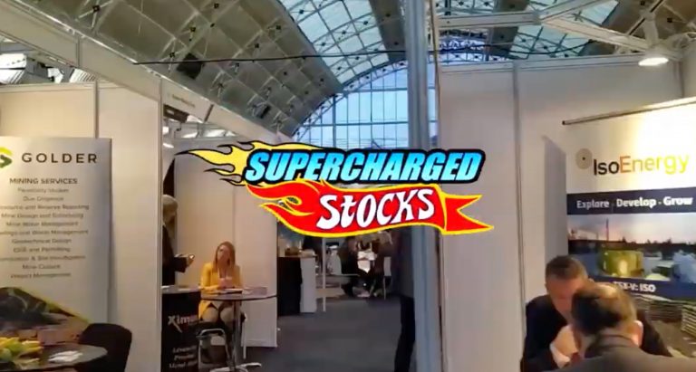 Supercharged Stocks logo on photo of conference